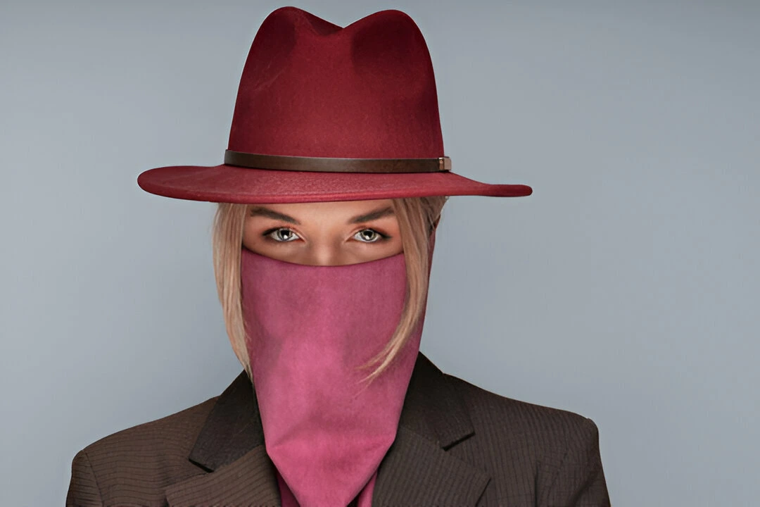 woman with stylish maroon hat and wild rag covering her face